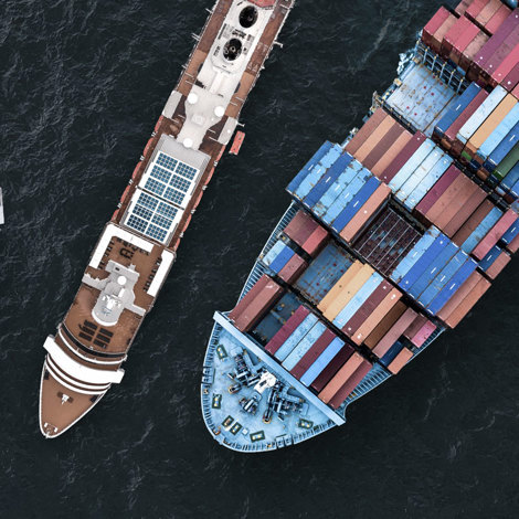 Aerial view of diverse cargo and passenger ships navigating the ocean.
