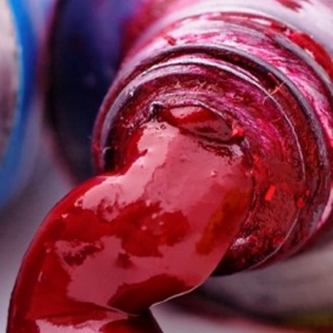 Tubes of colorful paint, including green, blue, red, and yellow, squeezed out.